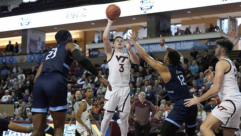 Nov 17, 2022; Charleston, South Carolina, USA; Virginia Tech Hokies guard Sean Pedulla (3) shoots the ball over Old Dominion Monarchs forward Ben Stanley (12) in the second half at TD Arena. Mandatory Credit: David Yeazell-USA TODAY Sports