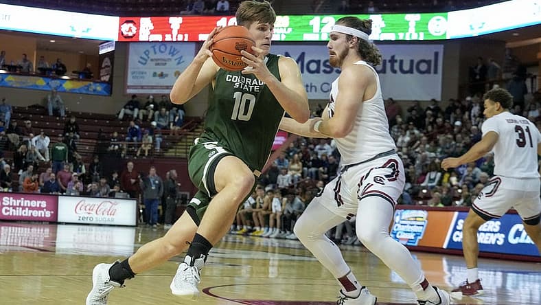 Nov 17, 2022; Charleston, South Carolina, USA; Colorado State Rams forward James Moors (10) drives the ball in the first half against a South Carolina Gamecocks defender at TD Arena. Mandatory Credit: David Yeazell-USA TODAY Sports