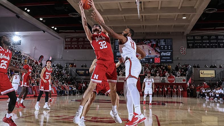 Nov 17, 2022; Queens, New York, USA; Nebraska Cornhuskers forward Wilhelm Breidenbach (32) and St. John's Red Storm center Joel Soriano (11) battle for a rebound in the first half at Carnesecca Arena. Mandatory Credit: Wendell Cruz-USA TODAY Sports