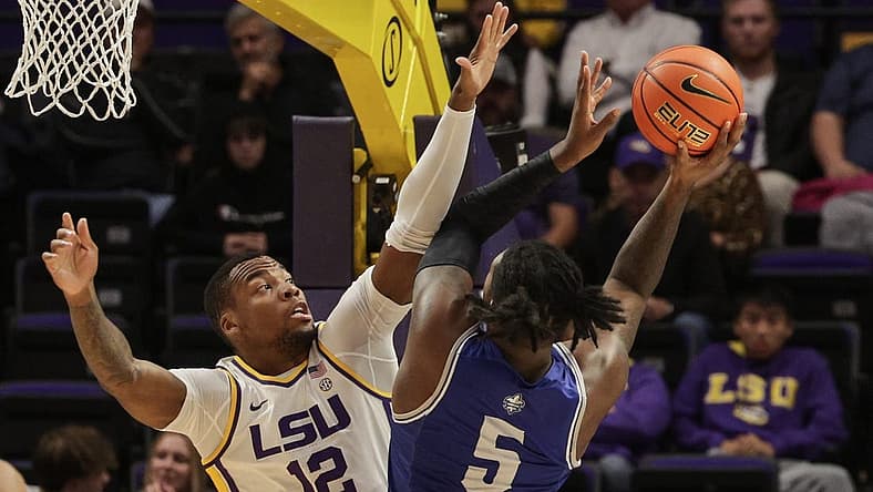 Nov 17, 2022; Baton Rouge, Louisiana, USA; LSU Tigers forward Mwani Wilkinson (5) shoots the ball against LSU Tigers forward KJ Williams (12) during the first half at Pete Maravich Assembly Center. Mandatory Credit: Stephen Lew-USA TODAY Sports