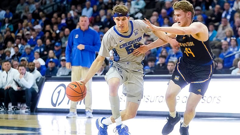 Nov 17, 2022; Omaha, Nebraska, USA; Creighton Bluejays guard Baylor Scheierman (55) drives with the ball against UC Riverside Highlanders forward Wil Tattersall (14) during the first half at CHI Health Center Omaha. Mandatory Credit: Dylan Widger-USA TODAY Sports