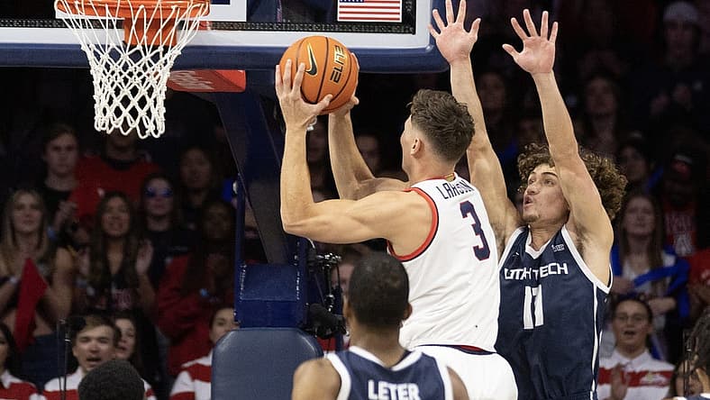 Nov 17, 2022; Tucson, Arizona, USA; University of Arizona Wildcats guard Pelle Larsson (3) goes up for a shot against Utah Tech guard Noa Gonsalves (11) in the first half at McKale Center. Mandatory Credit: David Cruz-USA TODAY Sports