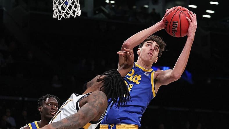Nov 17, 2022; Brooklyn, New York, USA; Pittsburgh Panthers forward Jorge Diaz Graham (31) rebounds against Virginia Commonwealth Rams forward Jalen DeLoach (4) during the second half at Barclays Center. Mandatory Credit: Vincent Carchietta-USA TODAY Sports