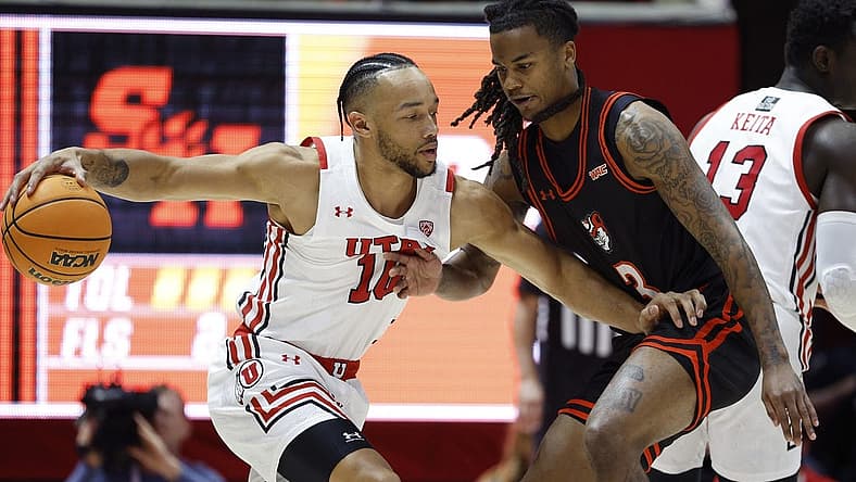 Nov 17, 2022; Salt Lake City, Utah, USA; Utah Utes guard Marco Anthony (10) drives against guard Ronnie Stapp (3) in the fits half at Jon M. Huntsman Center. Mandatory Credit: Jeffrey Swinger-USA TODAY Sports