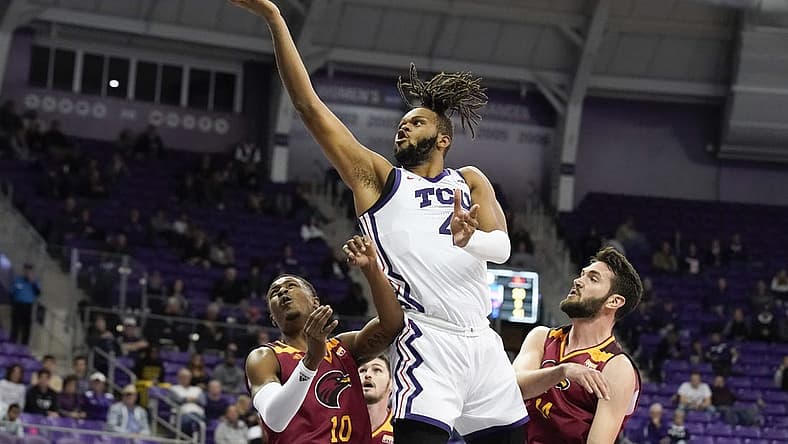 Nov 17, 2022; Fort Worth, Texas, USA; TCU Horned Frogs center Eddie Lampkin Jr. (4) shoots over Louisiana Monroe Warhawks guard Langston Powell (10) and forward Victor Bafutto (14) during the second half at Ed and Rae Schollmaier Arena. Mandatory Credit: Raymond Carlin III-USA TODAY Sports
