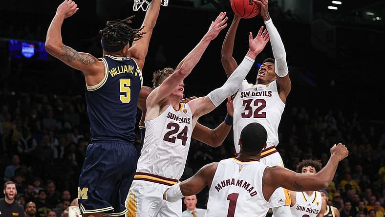 Nov 17, 2022; Brooklyn, New York, USA; Arizona State Sun Devils forward Alonzo Gaffney (32) rebounds in front of forward Duke Brennan (24) and Michigan Wolverines forward Terrance Williams II (5) during the first half at Barclays Center. Mandatory Credit: Vincent Carchietta-USA TODAY Sports