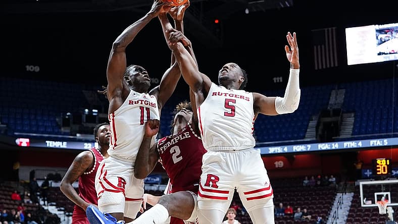 Nov 18, 2022; Uncasville, Connecticut, USA;  Rutgers Scarlet Knights center Clifford Omoruyi (11) and Rutgers Scarlet Knights forward Aundre Hyatt (5) grab a rebound against the Temple Owls during the first half at Mohegan Sun Arena. Mandatory Credit: Gregory Fisher-USA TODAY Sports