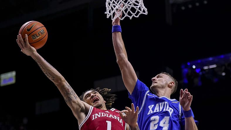 Nov 18, 2022; Cincinnati, Ohio, USA; Indiana Hoosiers guard Jalen Hood-Schifino (1) drives to the basket against Xavier Musketeers forward Jack Nunge (24) in the first half at Cintas Center. Mandatory Credit: Katie Stratman-USA TODAY Sports