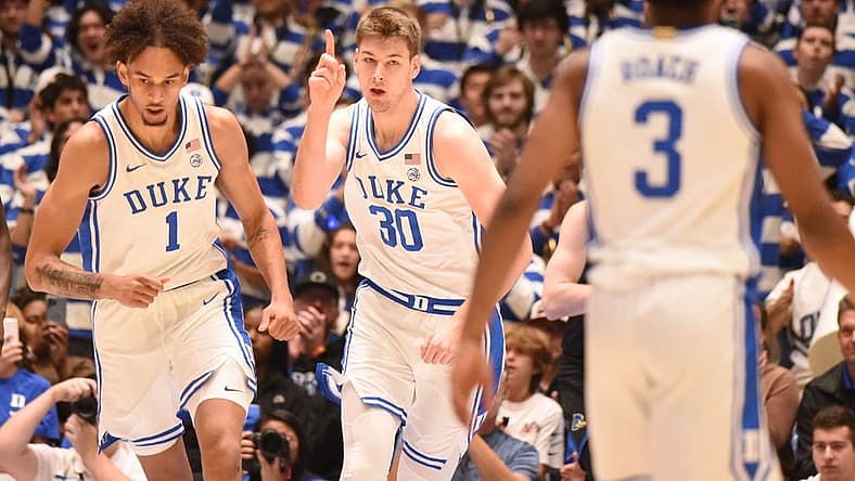 Nov 18, 2022; Durham, North Carolina, USA; Duke Blue Devils center Kyle Filipowski (30) gestures after scoring during the first half against the Delaware Blue Hens at Cameron Indoor Stadium. Mandatory Credit: Rob Kinnan-USA TODAY Sports
