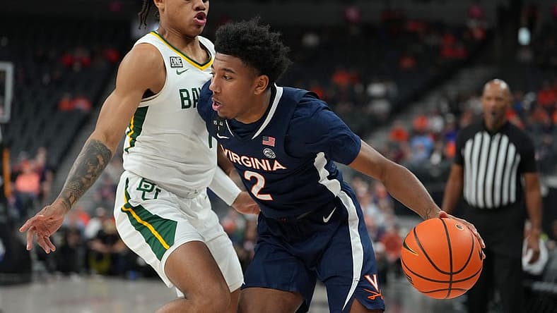 Nov 18, 2022; Las Vegas, Nevada, USA; Virginia Cavaliers guard Reece Beekman (2) dribbles against Baylor Bears guard Keyonte George (1) during the first half at T-Mobile Arena. Mandatory Credit: Stephen R. Sylvanie-USA TODAY Sports