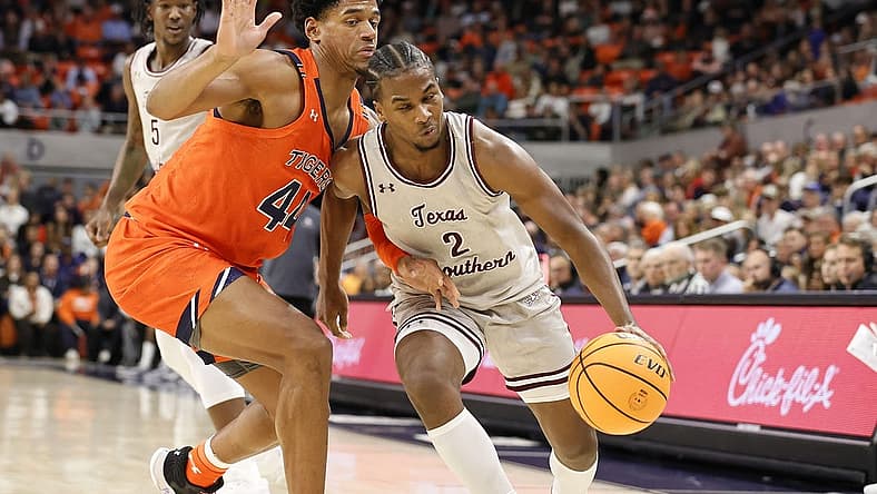 Nov 18, 2022; Auburn, Alabama, USA;  Auburn Tigers center Dylan Cardwell (44) blocks Texas Southern Tigers forward Davon Barnes (2) during the first half at Neville Arena. Mandatory Credit: John Reed-USA TODAY Sports
