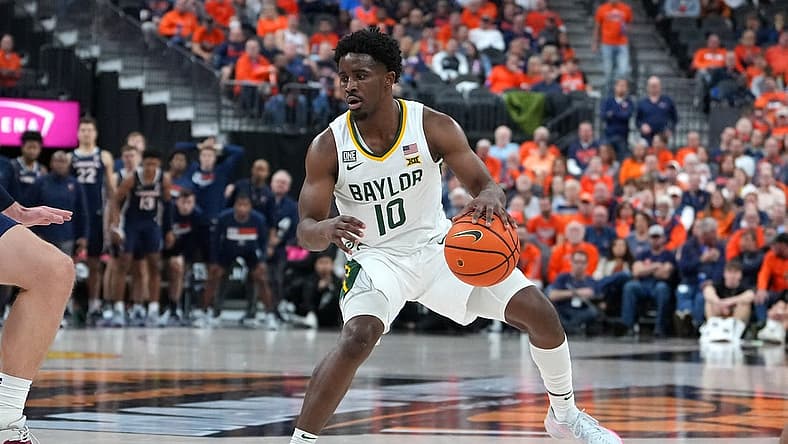 Nov 18, 2022; Las Vegas, Nevada, USA; Baylor Bears guard Adam Flagler (10) dribbles against the Virginia Cavaliers during the second half at T-Mobile Arena. Mandatory Credit: Stephen R. Sylvanie-USA TODAY Sports