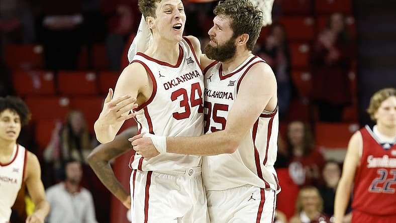 Nov 18, 2022; Norman, Oklahoma, USA; Oklahoma Sooners forward Jacob Groves (34) and forward Tanner Groves (35) celebrate after Jacob blocked a shot by South Alabama during the second half at Lloyd Noble Center. Oklahoma won 64-60. Mandatory Credit: Alonzo Adams-USA TODAY Sports