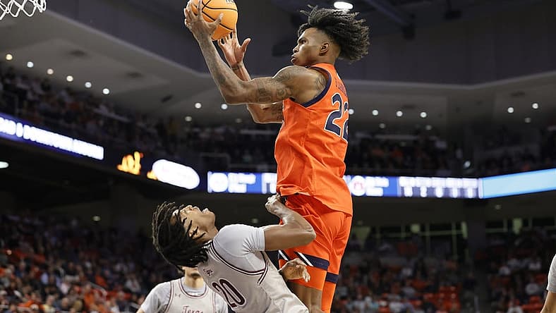 Nov 18, 2022; Auburn, Alabama, USA; Auburn Tigers guard Allen Flanigan (22) shoots over Texas Southern Tigers guard Kehlin Farooq (20) during the second half at Neville Arena. Mandatory Credit: John Reed-USA TODAY Sports