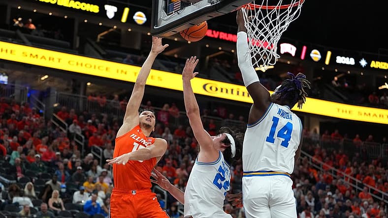 Nov 18, 2022; Las Vegas, Nevada, USA; Illinois Fighting Illini guard RJ Melendez (15) shoots against UCLA Bruins guard Jaime Jaquez Jr. (24) and forward Kenneth Nwuba (14) during the first half at T-Mobile Arena. Mandatory Credit: Stephen R. Sylvanie-USA TODAY Sports