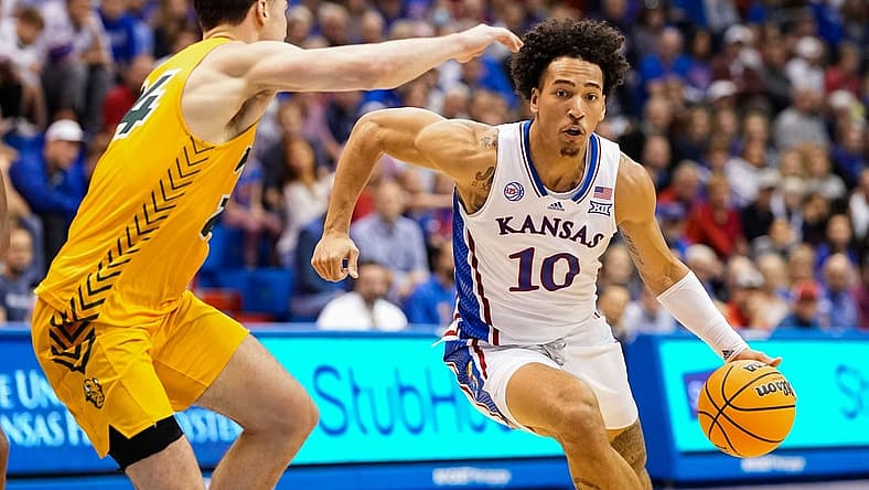 Nov 10, 2022; Lawrence, Kansas, USA; Kansas Jayhawks forward Jalen Wilson (10) drives against North Dakota State Bison guard Boden Skunberg (14) during the second half at Allen Fieldhouse. Mandatory Credit: Jay Biggerstaff-USA TODAY Sports