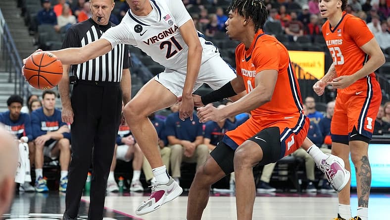 Nov 20, 2022; Las Vegas, Nevada, USA; Virginia Cavaliers forward Kadin Shedrick (21) attempts to keep a ball in play against the Illinois Fighting Illini during the first half at T-Mobile Arena. Mandatory Credit: Stephen R. Sylvanie-USA TODAY Sports