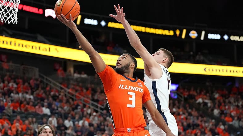 Nov 20, 2022; Las Vegas, Nevada, USA; Illinois Fighting Illini guard Jayden Epps (3) shoots inside the defense of Virginia Cavaliers guard Isaac McKneely (11) during the first half at T-Mobile Arena. Mandatory Credit: Stephen R. Sylvanie-USA TODAY Sports