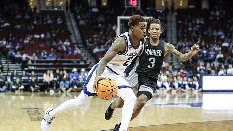 Nov 20, 2022; Newark, New Jersey, USA; Seton Hall Pirates guard Al-Amir Dawes (2) drives past Wagner Seahawks guard DeLonnie Hunt (3) in the first half at Prudential Center. Mandatory Credit: Wendell Cruz-USA TODAY Sports