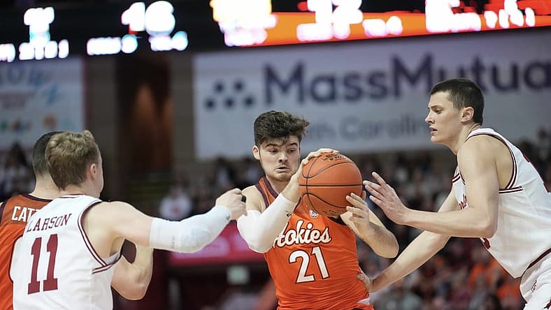 Nov 20, 2022; Charleston, South Carolina, USA; Virginia Tech Hokies forward Grant Basile (21) fights for a rebound in the first half against the Charleston Cougars at TD Arena. Mandatory Credit: David Yeazell-USA TODAY Sports