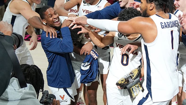 Nov 20, 2022; Las Vegas, Nevada, USA; Virginia Cavaliers guard Reece Beekman (2) is congratulated by team mates after being named Most Valuable Player of the Continental Tire Main Event Championship game against the Illinois Fighting Illini at T-Mobile Arena. Mandatory Credit: Stephen R. Sylvanie-USA TODAY Sports