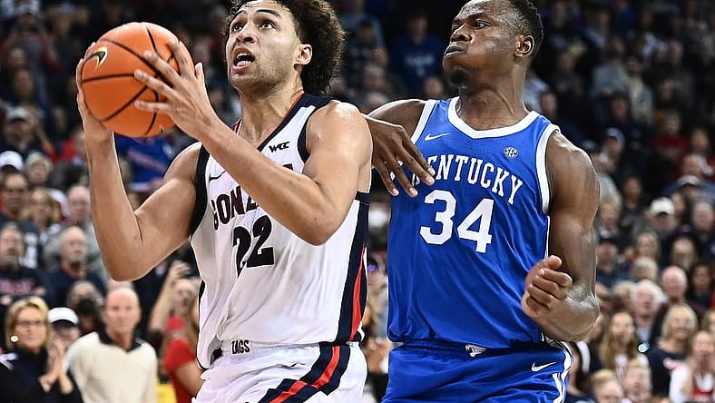 Nov 20, 2022; Spokane, Washington, USA; Gonzaga Bulldogs forward Anton Watson (22) shoots the ball against Kentucky Wildcats forward Oscar Tshiebwe (34) in the second half at Spokane Arena. Gonzaga won 88-72. Mandatory Credit: James Snook-USA TODAY Sports
