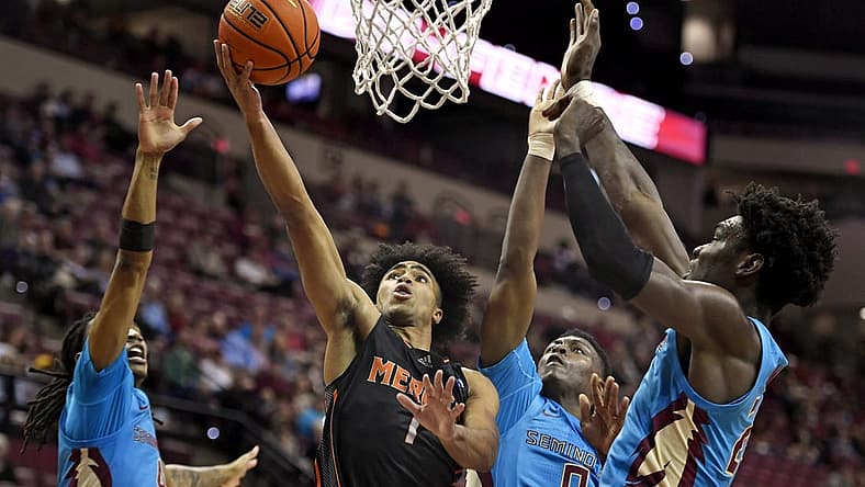 Nov 21, 2022; Tallahassee, Florida, USA; Mercer Bears guard Kamar Robertson (1) shoots the ball past Florida State Seminoles defenders during the first half at Donald L. Tucker Center. Mandatory Credit: Melina Myers-USA TODAY Sports