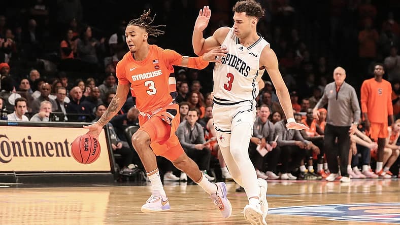 Nov 21, 2022; Brooklyn, New York, USA; Syracuse Orange guard Judah Mintz (3) drives past Richmond Spiders forward Tyler Burton (3) in the first half at Barclays Center. Mandatory Credit: Wendell Cruz-USA TODAY Sports