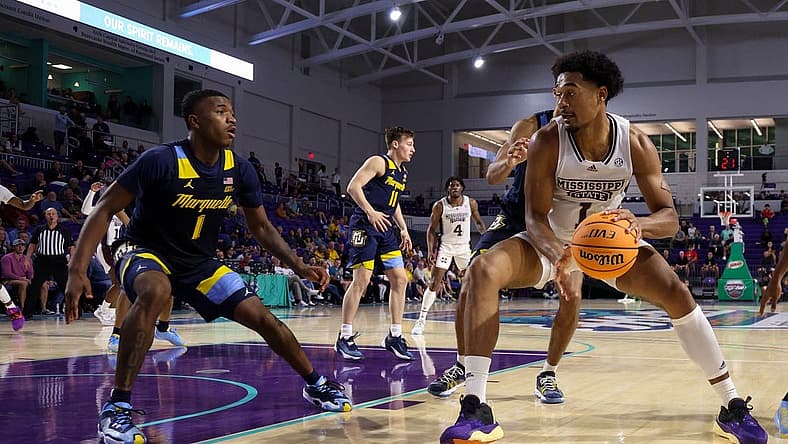 Nov 21, 2022; Fort Myers, Florida, USA; Mississippi State Bulldogs forward Tolu Smith (1) drives to the basket defended by Marquette Golden Eagles guard Kam Jones (1) in the second half during the Fort Myers Tip-off at Suncoast Credit Union Arena. Mandatory Credit: Nathan Ray Seebeck-USA TODAY Sports