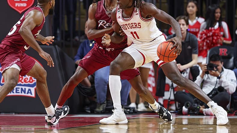 Nov 22, 2022; Piscataway, New Jersey, USA; Rutgers Scarlet Knights center Clifford Omoruyi (11) drives to the basket during the first half against Rider Broncs guard Corey McKeithan (3) at Jersey Mike's Arena. Mandatory Credit: Vincent Carchietta-USA TODAY Sports