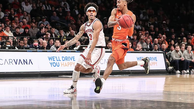 Nov 22, 2022; Brooklyn, New York, USA; Syracuse Orange guard Judah Mintz (3) drives past St. John's Red Storm guard Andre Curbelo (3) in the first half at Barclays Center. Mandatory Credit: Wendell Cruz-USA TODAY Sports