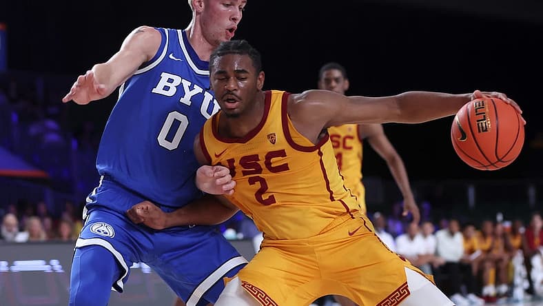 Nov 23, 2022; Paradise Island, BAHAMAS; USC Trojans guard Reese Dixon-Waters (2) dribbles as Brigham Young Cougars forward Noah Waterman (0) defends during the first half at Imperial Arena. Mandatory Credit: Kevin Jairaj-USA TODAY Sports