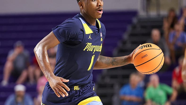 Nov 23, 2022; Fort Myers, Florida, USA;  Marquette Golden Eagles guard Kam Jones (1) controls the ball against the Georgia Tech Yellow Jackets in the first half during the Fort Myers Tip-Off Beach Division third place game at Suncoast Credit Union Arena. Mandatory Credit: Nathan Ray Seebeck-USA TODAY Sports