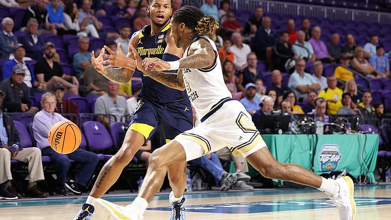 Nov 23, 2022; Fort Myers, Florida, USA; Georgia Tech Yellow Jackets guard Deivon Smith (5) steals the ball from Marquette Golden Eagles forward David Joplin (23) in the first half during the Fort Myers Tip-Off Beach Division third place game at Suncoast Credit Union Arena. Mandatory Credit: Nathan Ray Seebeck-USA TODAY Sports