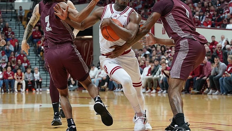 Nov 23, 2022; Bloomington, Indiana, USA; Indiana Hoosiers guard Xavier Johnson (0) is fouled by Little Rock Trojans forward DeAntoni Gordon (1) during the first half at Simon Skjodt Assembly Hall. Mandatory Credit: Robert Goddin-USA TODAY Sports