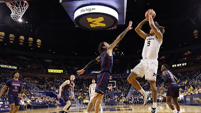 Nov 23, 2022; Ann Arbor, Michigan, USA; Michigan Wolverines forward Terrance Williams II (5) shoots defended by Jackson State Tigers forward Trace Young (3) in the first half at Crisler Center. Mandatory Credit: Rick Osentoski-USA TODAY Sports