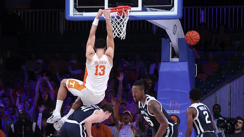 Nov 23, 2022; Paradise Island, BAHAMAS; Tennessee Volunteers forward Olivier Nkamhoua (13) dunks over Butler Bulldogs guard Simas Lukosius (41) during the second half at Imperial Arena. Mandatory Credit: Kevin Jairaj-USA TODAY Sports