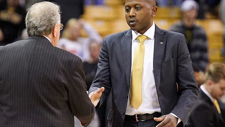 Nov 23, 2022; Columbia, Missouri, USA; Coastal Carolina Chanticleers head coach Cliff Ellis, left, shakes hands with Missouri Tigers head coach Dennis Gates after a game at Mizzou Arena. Mandatory Credit: Denny Medley-USA TODAY Sports