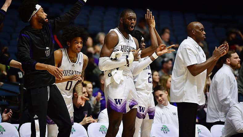 Nov 23, 2022; Anaheim, California, USA; Washington Huskies center Franck Kepnang (11) and the bench react against the Fresno State Bulldogs during the second half at Anaheim Convention Center. Mandatory Credit: Gary A. Vasquez-USA TODAY Sports