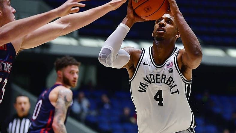 Nov 23, 2022; Anaheim, California, USA; Vanderbilt Commodores guard Jordan Wright (4) moves to the basket against St. Mary's Gaels guard Leemet Bockler (23) during the second half at Anaheim Convention Center. Mandatory Credit: Gary A. Vasquez-USA TODAY Sports