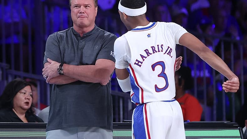 Nov 24, 2022; Paradise Island, BAHAMAS; Kansas Jayhawks head coach Bill Self speaks with Kansas Jayhawks guard Dajuan Harris Jr. (3) during the first half against the Wisconsin Badgers at Imperial Arena. Mandatory Credit: Kevin Jairaj-USA TODAY Sports