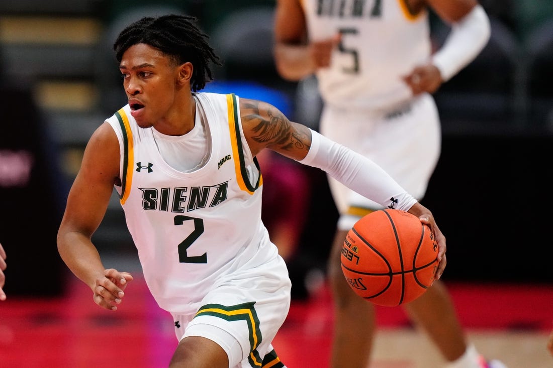 Nov 24, 2022; Orlando, FL, USA; Siena Saints guard Javian McCollum (2) drives towards the basket against the Florida State Seminoles during the second half at ESPN Wide World of Sports. Mandatory Credit: Rich Storry-USA TODAY Sports