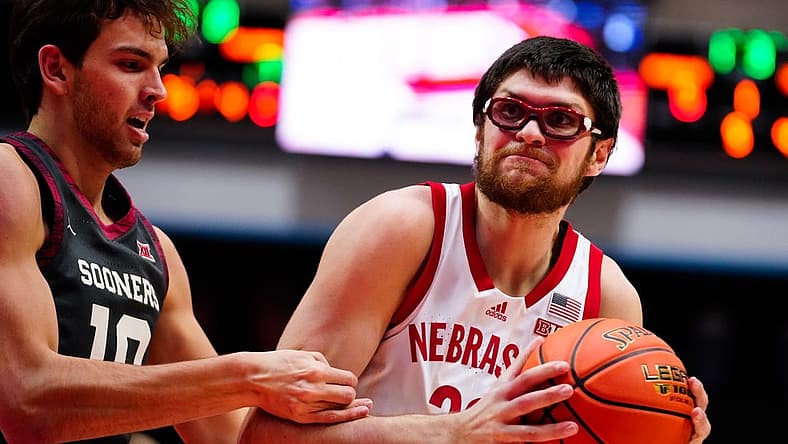 Nov 24, 2022; Orlando, Florida, USA; Nebraska Cornhuskers forward Oleg Kojenets (33) battles for possession with Oklahoma Sooners forward Yaya Keita (11) during the first half at State Farm Field House. Mandatory Credit: Rich Storry-USA TODAY Sports