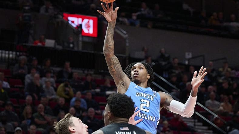 Nov 24, 2022; Portland, Oregon, USA; North Carolina Tar Heels guard Caleb Love (2) puts a shot up during the second half against the Portland Pilots at Moda Center. North Carolina won the game 89-81. Mandatory Credit: Troy Wayrynen-USA TODAY Sports
