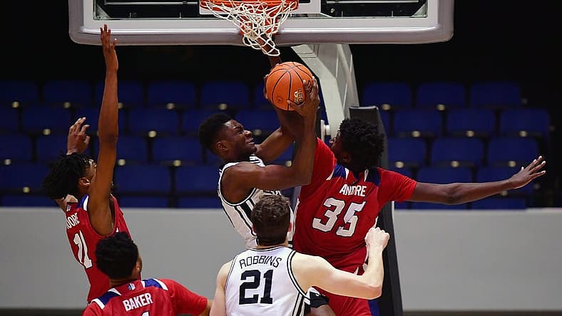 Nov 24, 2022; Anaheim, California, USA; Vanderbilt Commodores guard Graham Calton (22) moves to the basket against Fresno State Bulldogs center Eduardo Andre (35) during the first half at Anaheim Convention Center. Mandatory Credit: Gary A. Vasquez-USA TODAY Sports