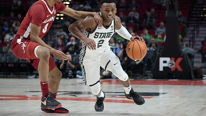 Nov 24, 2022; Portland, Oregon, USA; Michigan State Spartans guard Tyson Walker (2) drives to the basket during the first half against Alabama Crimson Tide guard Rylan Griffen (3) at Moda Center. Mandatory Credit: Troy Wayrynen-USA TODAY Sports