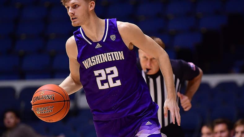 Nov 24, 2022; Anaheim, California, USA; Washington Huskies guard Cole Bajema (22) moves the ball against the St. Mary's Gaels during the first half at Anaheim Convention Center. Mandatory Credit: Gary A. Vasquez-USA TODAY Sports