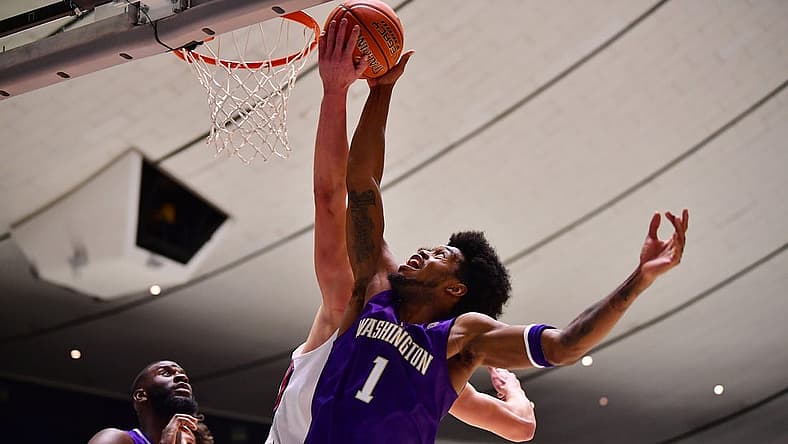 Nov 24, 2022; Anaheim, California, USA; Washington Huskies forward Keion Brooks (1) plays for the ball against St. Mary's Gaels center Mitchell Saxen (11)  during the second half at Anaheim Convention Center. Mandatory Credit: Gary A. Vasquez-USA TODAY Sports
