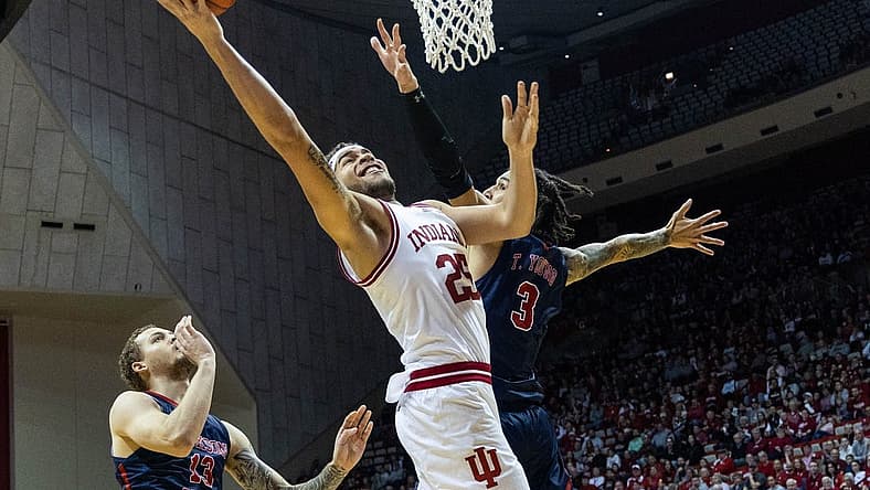Nov 25, 2022; Bloomington, Indiana, USA; Indiana Hoosiers forward Race Thompson (25) shoots the ball while Jackson State Tigers forward Trace Young (3) defends in the first half at Simon Skjodt Assembly Hall. Mandatory Credit: Trevor Ruszkowski-USA TODAY Sports
