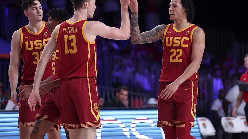 Nov 25, 2022; Paradise Island, BAHAMAS; USC Trojans guard Tre White (22) celebrates with USC Trojans guard Drew Peterson (13) during the first half against the Wisconsin Badgers at Imperial Arena. Mandatory Credit: Kevin Jairaj-USA TODAY Sports